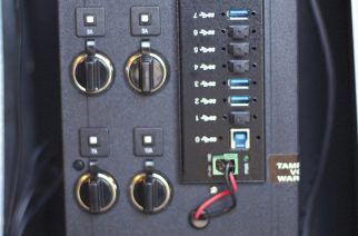 Image 1: The upper left side of the Kendrick Model 208-IPP-C-3.0 Imaging Power Panel contains four 12-volt automobile-type outlets (two 5-amp, one 7-amp and one 10-amp). Other voltages are available by special order. The right side contains eight USB-3.0 ports (seven powered ports, plus one USB Standard B port). The bottom of the panel contains an LCD readout, an on/off switch and an Anderson-type jack for external power.